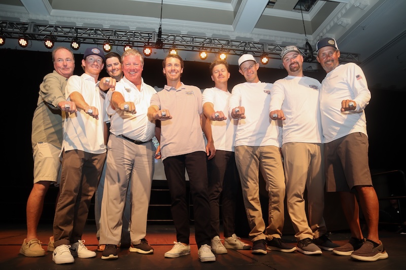 The 2026 championship team showing off their championship rings on stage